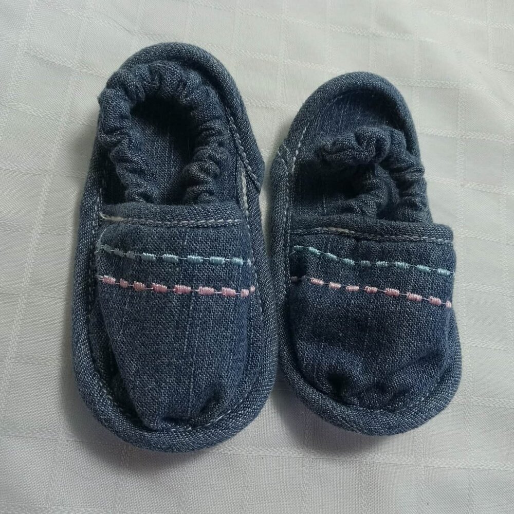 Small denim sandals with embroidery, year 2005, one of the soles has yellowed